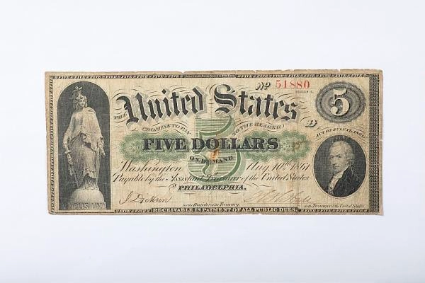 An 1861 five-dollar U.S. Demand Note, an example of early large-size federal paper currency.